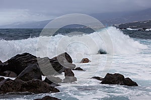 Waves breaking over rocks