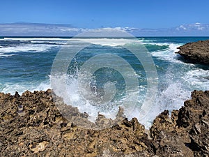 Waves breaking over rocks at Islote Sancho, Riviere Des Galets, Mauritius