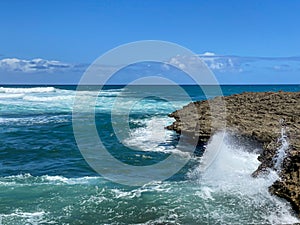 Waves breaking over rocks at Islote Sancho, Riviere Des Galets, Mauritius
