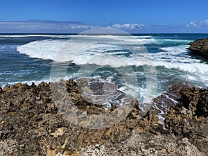 Waves breaking over rocks at Islote Sancho, Riviere Des Galets, Mauritius