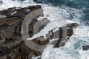 Waves breaking over rocky headland