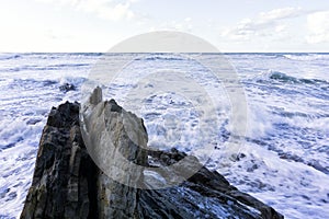 Waves breaking on the rock