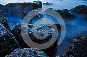 Waves breaking on rocks