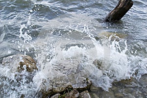 Waves breaking rocks