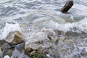 Waves breaking rocks