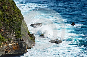 Waves breaking on the rocks. Uluwatu Bali, Indonesia