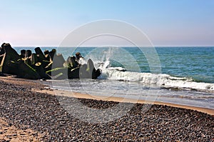 Waves breaking on rocky beach