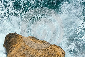 Waves breaking on rocky coast.