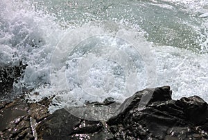 Waves breaking at rocky coast