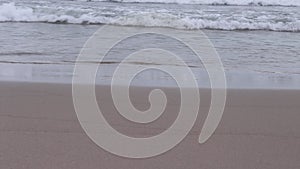 Waves breaking on sandy shore , Landscape nature sea background