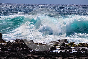 Waves breaking on shore