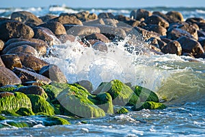 Waves breaking to stones