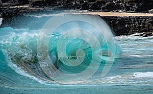 Waves in the surf from a beach in Hawaii featuring the eye of a wave