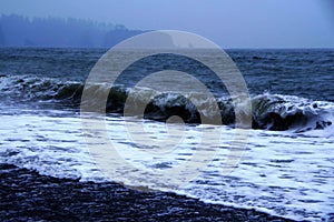 Waves coming ashore Clallam bay Washington