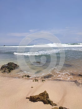 Waves, coral reefs, sky in the beach