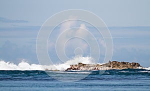 Waves crash against coastal rocks in Scotland