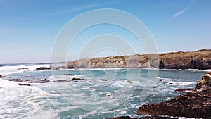 Waves crash against the rocky headlands of the western Portuguese coast on rainy days