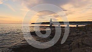 Waves Crash Along Shoreline at Marshall Point Lighthouse at Sunset