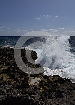 The waves crash on the coast of the island of Favignana
