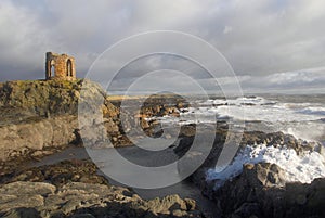 Waves crash on fife shore below Lady's tower