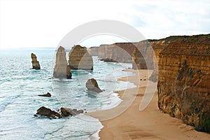 Waves crashing against rocky outcrops at the Twelve Apostles