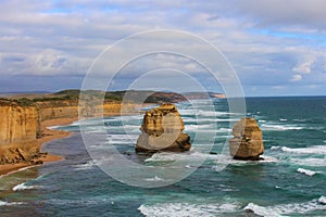 Waves crashing against rocky outcrops at the Twelve Apostles