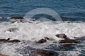 Waves crashing along a rocky coastline