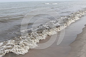 Waves crashing on lake michigan beach