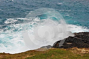 Waves crashing in a natural blowhole on the Australian coast