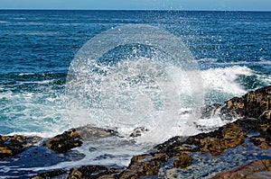 Waves crashing on the ocean rocks