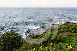 Waves crashing onto the rocks along the Bondi to Coogee coastal walk, Sydney, Australia