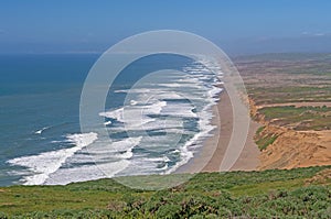 Waves Crashing onto a Sandy Beachon a Disappearing Coast