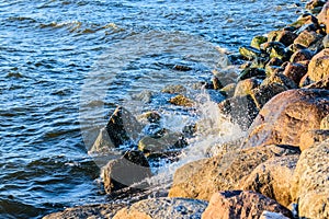 Waves crashing onto the stones of Baltic sea shore