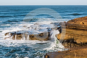 Waves Crashing Over Rock Formations at Sunset Cliffs