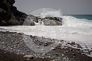 Waves crashing over rocks at Ajuy, Fuerteventura, Spain