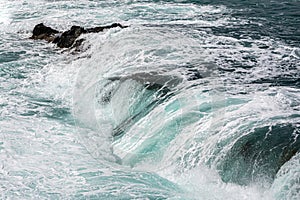 Waves crashing over rocks at Ajuy, Fuerteventura, Spain