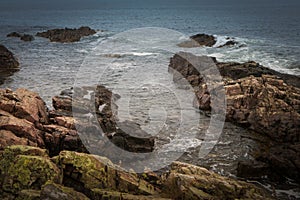 Waves Crashing Over Rocky Coastline