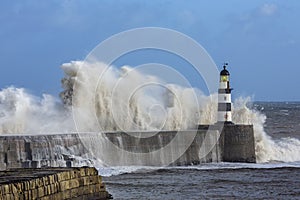 Waves crashing over Seaham Lighthouse photo