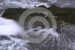 Waves crashing on rocks