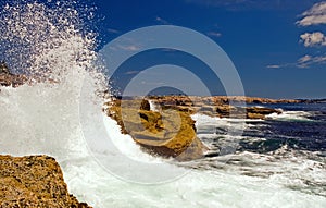 Waves crashing on rocks