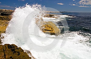 Waves crashing on rocks