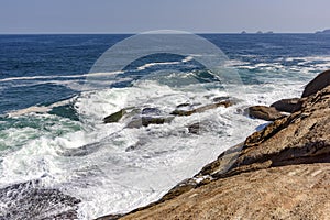 Waves crashing on the rocks photo