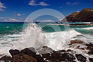 Waves crashing on rocks on the coast of Oahu, Hawaii