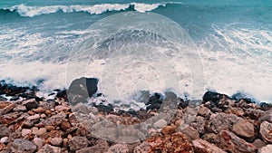 Waves crashing on the rocks on the coastline