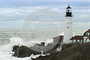 Waves Crashing on Rocks By Maine Lighthouse as Storm Passes