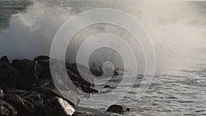 Waves crashing on rocks, mediterranean sea,Palavas les Flots, Herault, Occitanie,  France