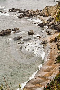 waves crashing on rocks, photo as a background , in playa del silencio , silent beach, principado de asturias, spain europe photo