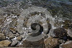 Waves crashing rocks on the shore