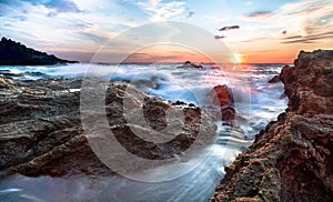 Waves crashing on rocks at sunset, Costa Rica