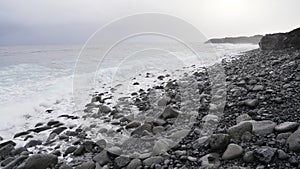 Waves crashing on a rocky seaside in Hawaii